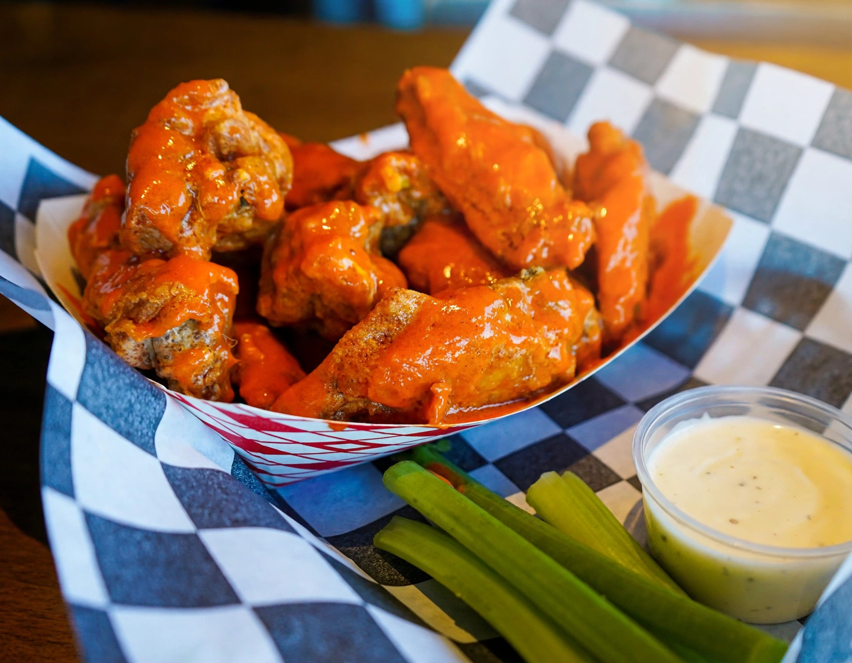 Buffalo wings basket with celery and ranch at Wings Sports Bar